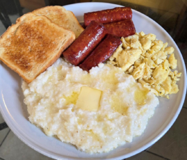 Grits eggs smoked sausage and toast (New Orleans breakfast)